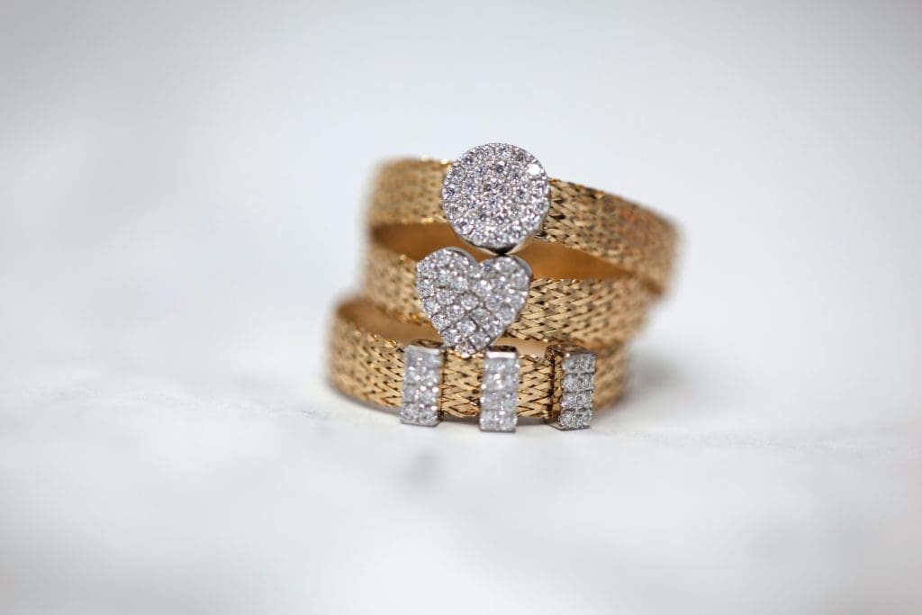 A stack of mixed metal rings | best jewelry for sensitive ears